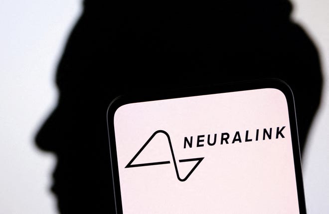 The Neuralink logo and the silhouette of Elon Musk are seen in this illustration taken Dec. 19, 2022.